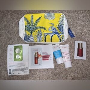 NWOT. Clarins Skincare Sample Set with Yellow and White Bag
